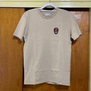 Suspicious Antwerp Sized M tan/cream colored short sleeved T-shirt